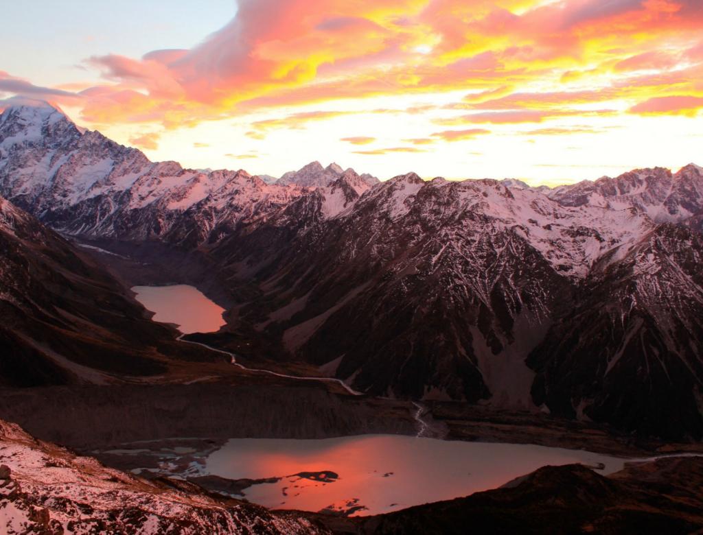 Sunrise creates a colorful sky in the Southern Alps