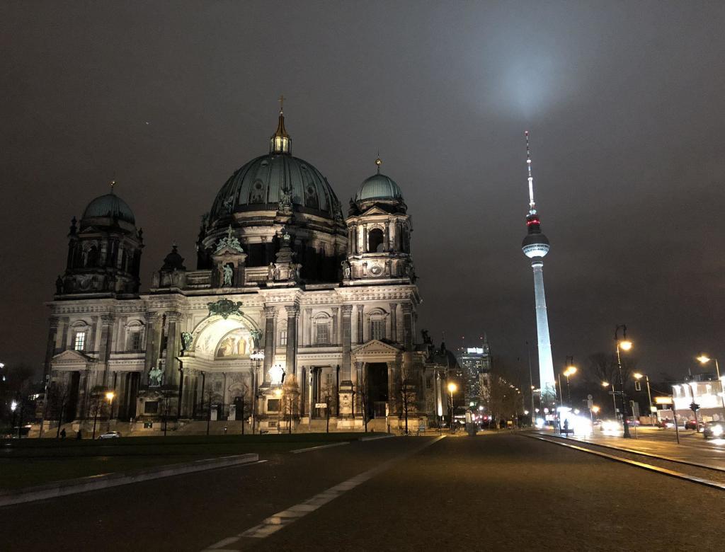 Berliner Dom and Fernsehturm in the cold night sky. 