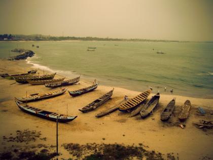 Boats on the shore near Elmina Castle in Ghana