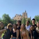 group of students standing in front of castle in Spain
