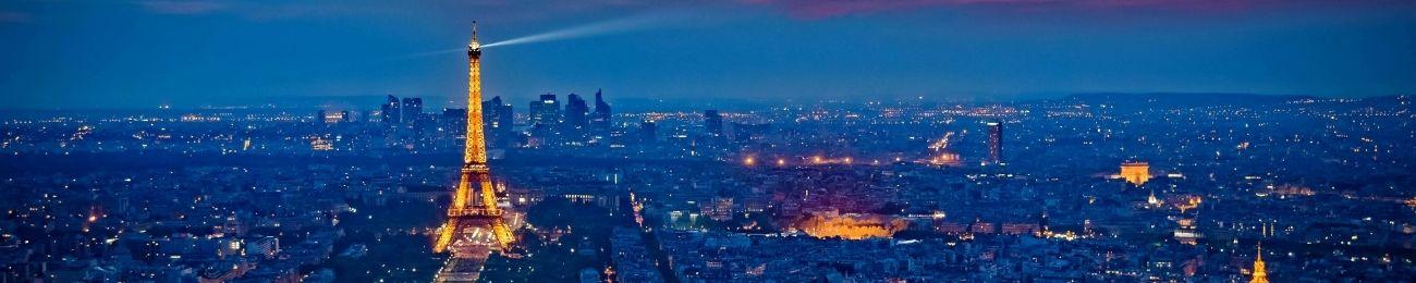 Paris skyline at night, featuring Eiffel tower