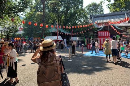A student walking toward an open air market