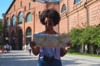 student looking at paper map