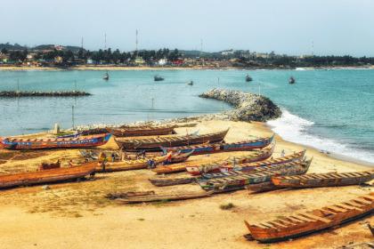 Fishing boats on shore of the ocean