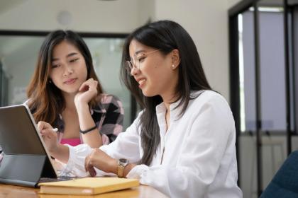 Two students looking at computer screen