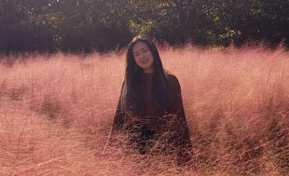 Photo of Eunjee standing in a field