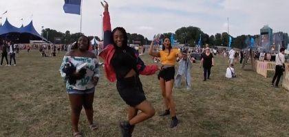 Screen cap of students celebrating at music festival