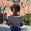 student looking at paper map