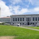 Photo of UC Berkeley library with Campanile in the background.